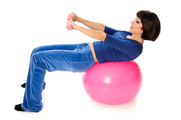 Image showing Exercises with dumbbells on a gymnastic ball