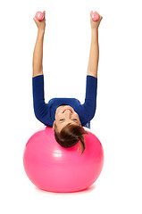 Image showing Exercises with dumbbells on a gymnastic ball