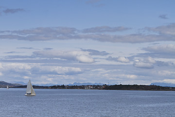 Image showing coastline with singel sailing boat in norway