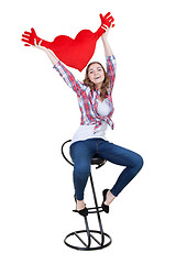 Image showing Beautiful girl with A red plush heart