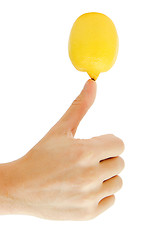 Image showing man's hand holding a lemon