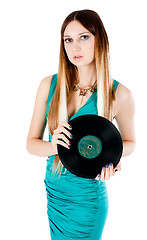 Image showing Pretty girl holding vinyl disc