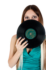 Image showing Pretty girl holding vinyl disc