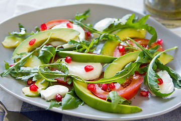 Image showing Avocado with mozzarella,pomegranate and rocket salad