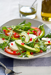 Image showing Avocado with mozzarella,pomegranate and rocket salad