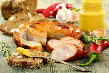 Image showing Sausage with black bread and hot mustard.