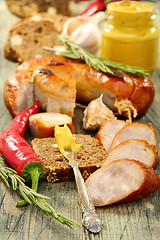 Image showing Rye bread with sausage and mustard.