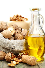 Image showing Walnut oil  and nuts in a bag.