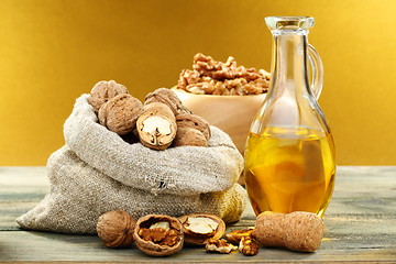 Image showing Walnut oil in bottle and nuts.