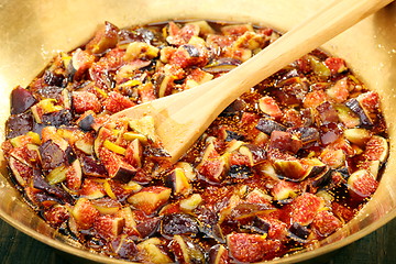 Image showing Fig slices with syrup closeup.