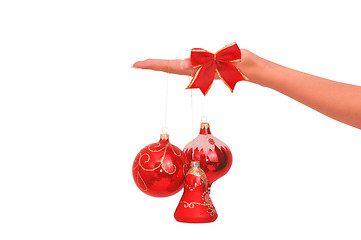 Image showing three Christmas-tree balls in the hand