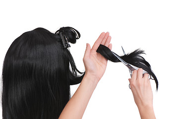 Image showing hairdresser cutting young woman