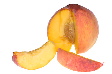 Image showing sweet delicious peach cut on the parts