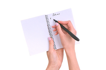 Image showing business woman writes ideas for business plan