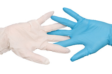 Image showing doctor put blue and white sterilized medical glove
