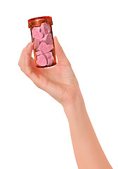 Image showing woman holding orange tube with love pills