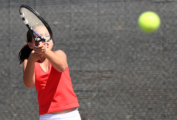 Image showing Young girl playing tennis