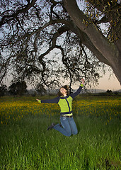 Image showing Jumping on the green field