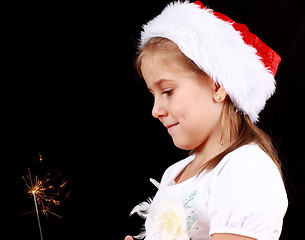 Image showing Girl holding sparkler