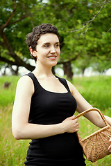 Image showing woman with basket in the garden 