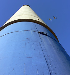 Image showing Blue, White and Black Chimney with Pigeons