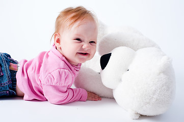 Image showing Baby girl with bear toy