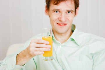 Image showing smiling man with a glass juice