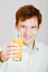 Image showing smiling man with a glass juice