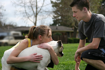 Image showing Teens with a dog