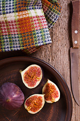 Image showing  fresh figs, old knife and  towel 