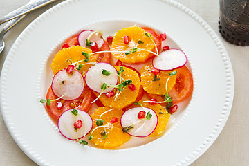 Image showing Orange with pomegranate and radish salad