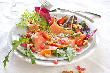 Image showing Smoked salmon with pomegranate and walnut salad