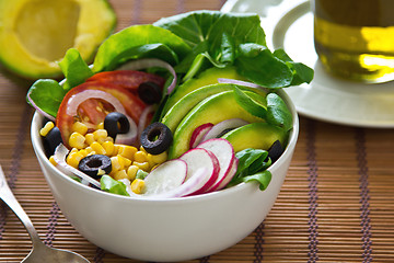 Image showing Avocado with sweetcorn and olive salad