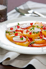 Image showing Orange with pomegranate and radish salad