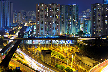 Image showing traffic light through city at night