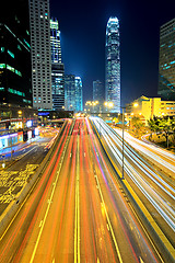 Image showing traffic light through city