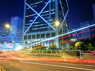 Image showing traffic light through city