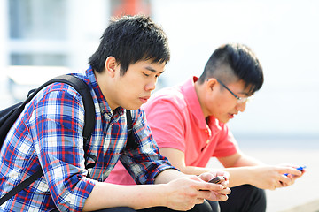 Image showing friend using phone
