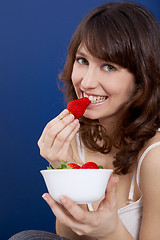 Image showing Eating strawberries