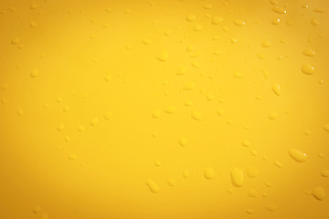 Image showing raindrops on the yellow metal