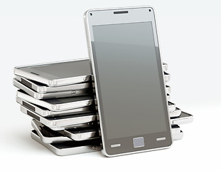 Image showing Stack of cellphones with touch screens over white