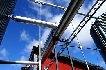 Image showing Industrial zone, Steel pipelines and valves against blue sky