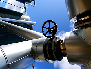 Image showing Industrial zone, Steel pipelines and valves against blue sky