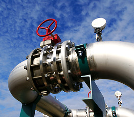 Image showing Industrial zone, Steel pipelines and valves against blue sky