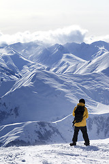 Image showing Snowboarder on top of mountain