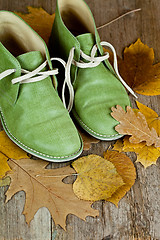 Image showing boots and yellow leaves