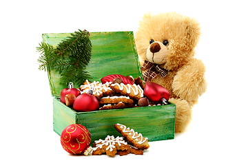 Image showing Christmas toys and gingerbread in a box.