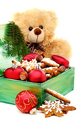 Image showing Christmas box with toys and cookies.