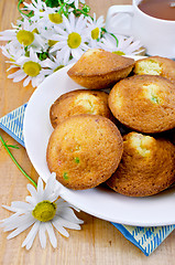 Image showing Biscuits with tea and camomiles