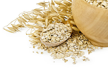 Image showing Oat flakes in a bowl and spoon